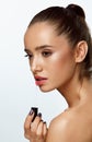 Beautiful Woman Doing Makeup Using Lip Gloss On Lips. Cosmetics Royalty Free Stock Photo