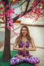 Beautiful woman doing spring yoga indoors