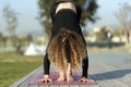 Woman doing yoga exercise away from city life Royalty Free Stock Photo