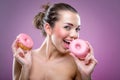 Beautiful woman with donuts. You may eat or not? Royalty Free Stock Photo