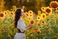 Beautiful woman in a dress in a field of sunflowers Royalty Free Stock Photo