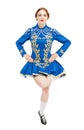 Beautiful woman in dress for Irish dance jumping isolated Royalty Free Stock Photo