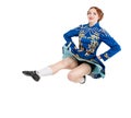 Beautiful woman in dress for Irish dance jumping isolated Royalty Free Stock Photo