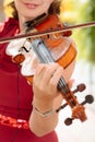 Beautiful woman in a dress plays the violin close-up Royalty Free Stock Photo