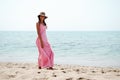 Beautiful woman with dress on a tropical beach