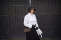 beautiful woman dressed in retro style, wearing a hat, gloves, with a lace umbrella and ridiquel Royalty Free Stock Photo