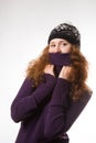 Beautiful woman dressed in winter clothes smiling - studio shots Royalty Free Stock Photo