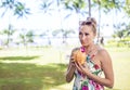 Beautiful woman drinking a cocktail in a coconut on a Hawaii vacation Royalty Free Stock Photo