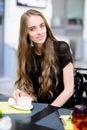 Beautiful woman drinking coffee at the cafe Royalty Free Stock Photo