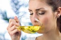 Beautiful woman drinking herbal tea