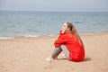 Beautiful woman drinking hot tea one Ocean Beach Royalty Free Stock Photo