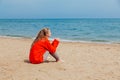 Beautiful woman drinking hot tea one Ocean Beach Royalty Free Stock Photo