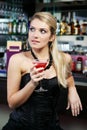 Beautiful woman drinking a martini at the bar Royalty Free Stock Photo