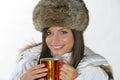 Beautiful woman drinking warm beverage Royalty Free Stock Photo