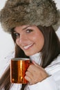 Beautiful woman drinking warm beverage Royalty Free Stock Photo