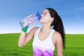 Beautiful woman drinking water on bottle Royalty Free Stock Photo