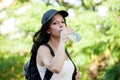 Beautiful woman drinking water while hiking Royalty Free Stock Photo