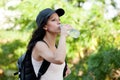 Beautiful woman drinking water while hiking Royalty Free Stock Photo