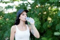 Beautiful woman drinking water while hiking Royalty Free Stock Photo