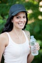 Beautiful woman drinking water while hiking Royalty Free Stock Photo