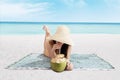 Beautiful woman drinks a coconut water