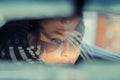 Beautiful woman driver reflecting in the rear view mirror Royalty Free Stock Photo