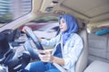 Beautiful woman driving a car on the road Royalty Free Stock Photo