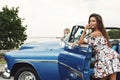 Beautiful woman driving a retro convertible car Royalty Free Stock Photo