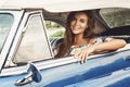 Beautiful woman driving a retro convertible car Royalty Free Stock Photo