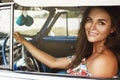 Beautiful woman driving a retro convertible car Royalty Free Stock Photo