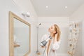 Beautiful woman drying her hair with a hair dryer Royalty Free Stock Photo