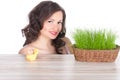 Beautiful woman with easter basket with green grass, chicken and smiling egg Royalty Free Stock Photo