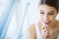 Beautiful woman eating chewing gum Royalty Free Stock Photo