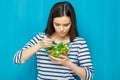 Beautiful woman eating healthy food green salad Royalty Free Stock Photo