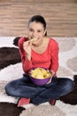 Beautiful woman eating junk food Royalty Free Stock Photo