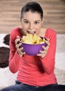 Beautiful woman eating junk food Royalty Free Stock Photo