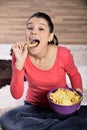 Beautiful woman eating junk food Royalty Free Stock Photo