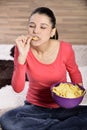 Beautiful woman eating junk food Royalty Free Stock Photo