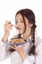 Beautiful woman eating piece of cake