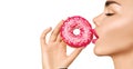 Beautiful woman eating pink donut Royalty Free Stock Photo