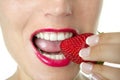 Beautiful woman eating a red strawberry Royalty Free Stock Photo