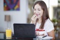 Beautiful woman eating strawberries Royalty Free Stock Photo