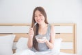 Beautiful woman eating yogurt with berries for breakfast Royalty Free Stock Photo