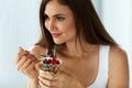 Beautiful Woman Eating Yogurt, Berries And Cereal. Healthy Diet Royalty Free Stock Photo