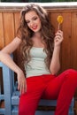 Beautiful woman eats a big candy sweet lollipop Royalty Free Stock Photo