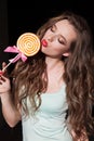 Beautiful woman eats a big candy sweet lollipop Royalty Free Stock Photo