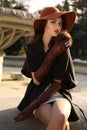 Beautiful woman in elegant coat,gloves and felt hat Royalty Free Stock Photo