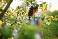 Girl in a flowering garden