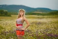 Beautiful woman enjoying daisy field, nice female lying down in meadow of flowers, pretty girl relaxing outdoor, having fun, holdi Royalty Free Stock Photo