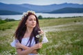 Beautiful woman enjoying daisy field, nice female lying down in meadow of flowers, pretty girl relaxing outdoor, having fun, Royalty Free Stock Photo